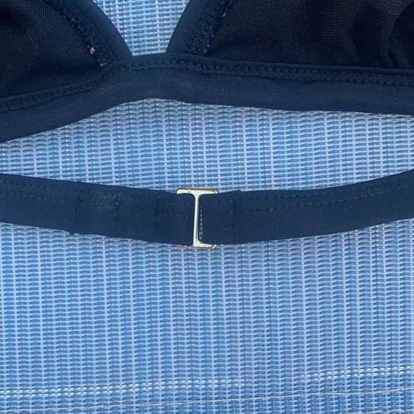 Black bikini top…. a strap that hooks in the back…. beautiful back detail.. - Picture 7 of 8